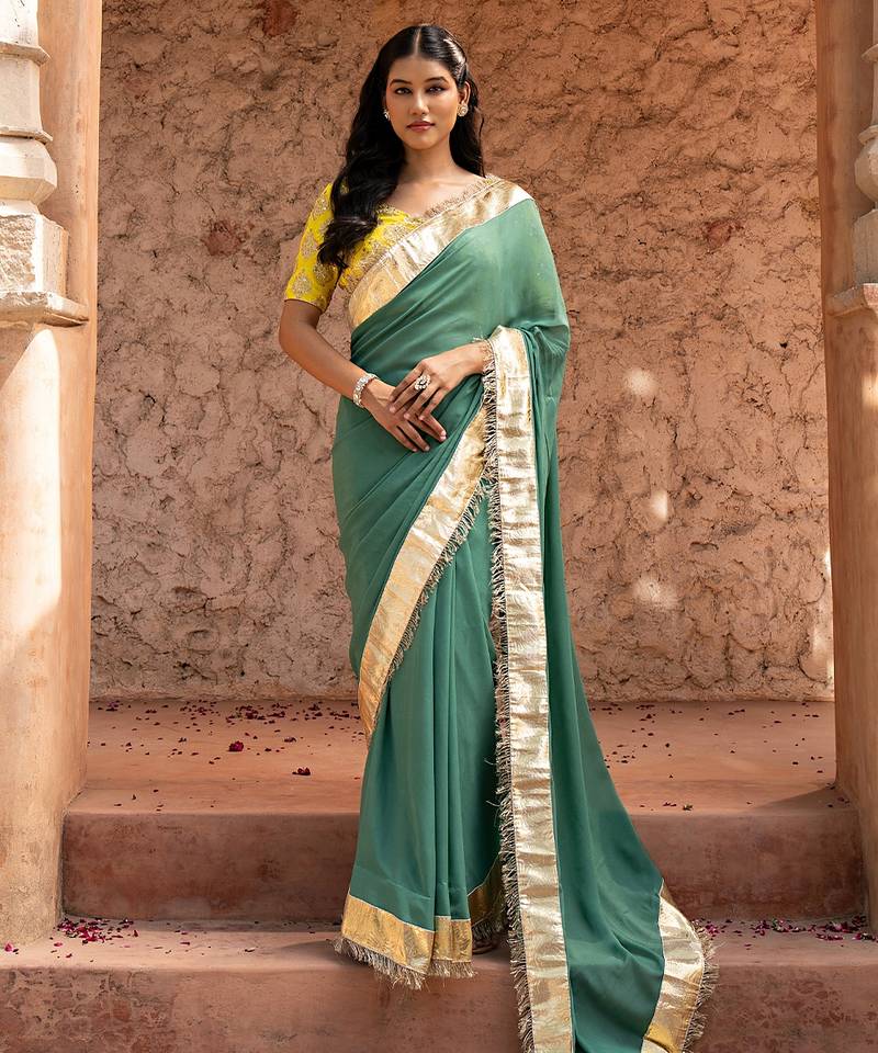 Sage green embroidered pure georgette saree