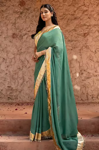 Sage green embroidered pure georgette saree
