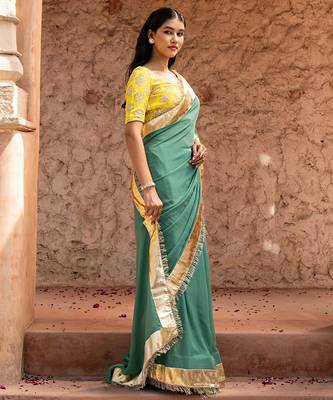 Sage green embroidered pure georgette saree 3