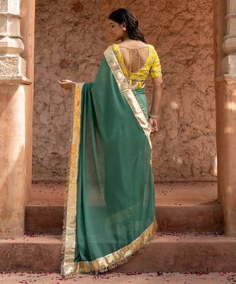 Sage green embroidered pure georgette saree 5