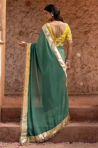 Sage green embroidered pure georgette saree