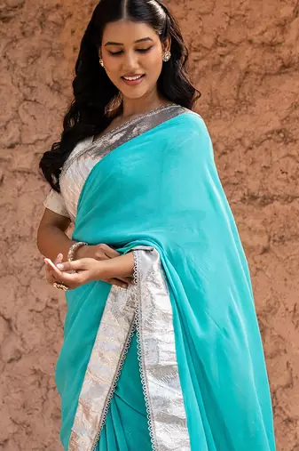 Sky blue embroidered pure georgette saree