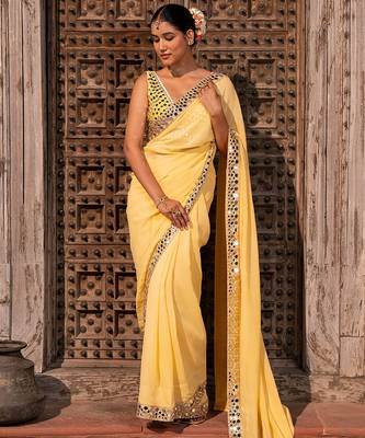 Butter yellow embroidered pure georgette saree 1