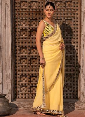 Butter yellow embroidered pure georgette saree 4