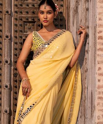 Butter yellow embroidered pure georgette saree 5