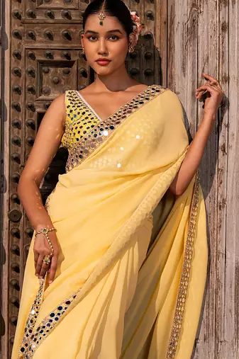 Butter yellow embroidered pure georgette saree