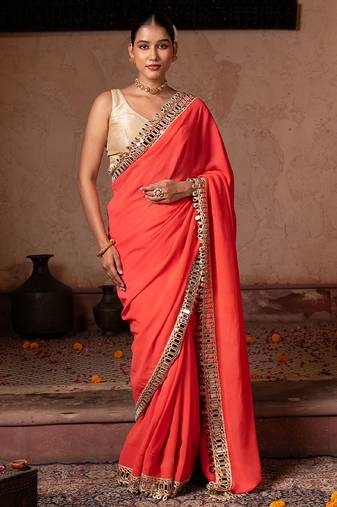 Coral orange embroidered pure georgette saree