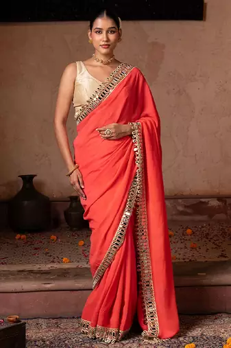 Coral orange embroidered pure georgette saree