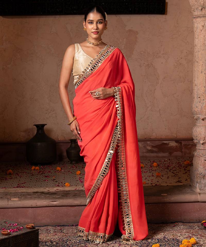 Coral orange embroidered pure georgette saree