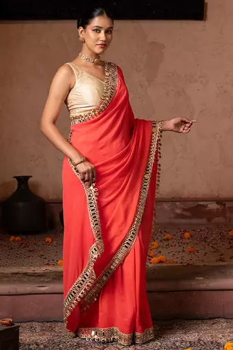 Coral orange embroidered pure georgette saree