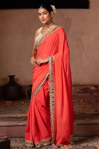 Coral orange embroidered pure georgette saree