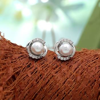 Silver color american diamond earrings with designer finish 1