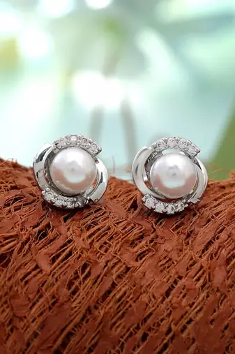 Silver color american diamond earrings with designer finish
