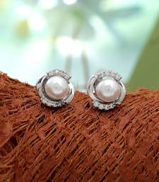 Silver color american diamond earrings with designer finish