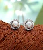 Silver color american diamond earrings with designer finish