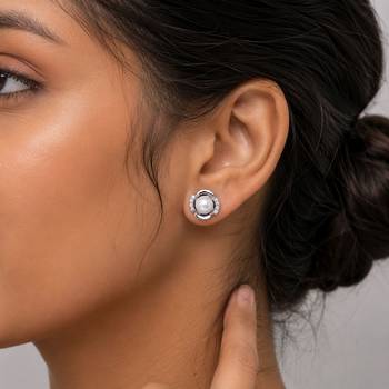 Silver color american diamond earrings with designer finish 2