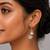 White color american diamond earrings with sparkling design
