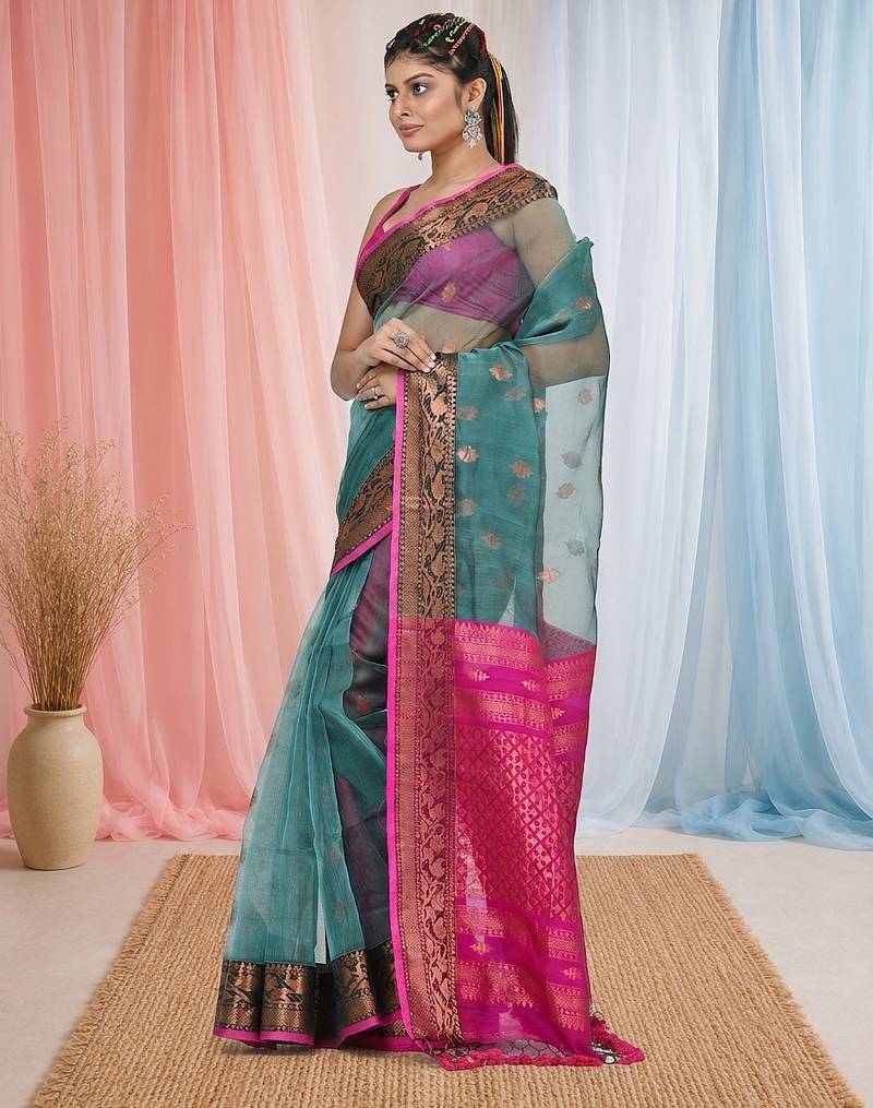 elegant teal and fuchsia resham saree with zari border