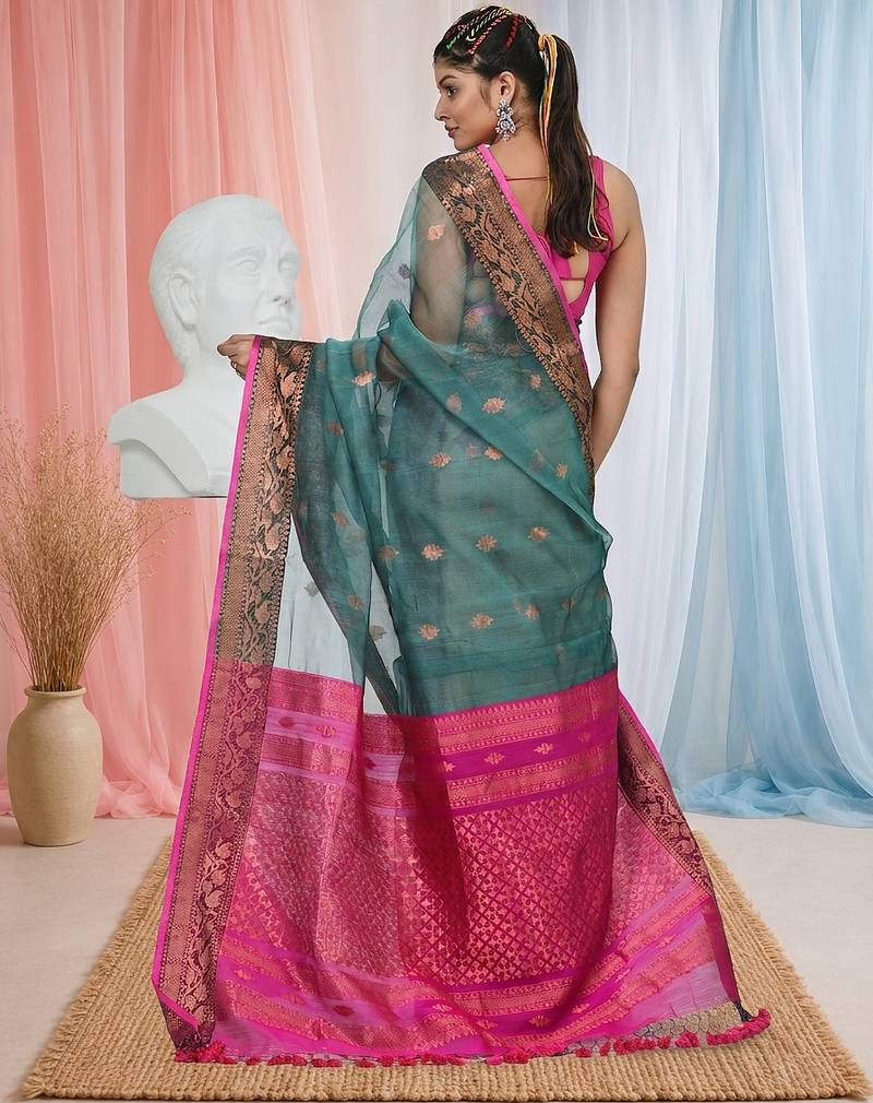 elegant teal and fuchsia resham saree with zari border