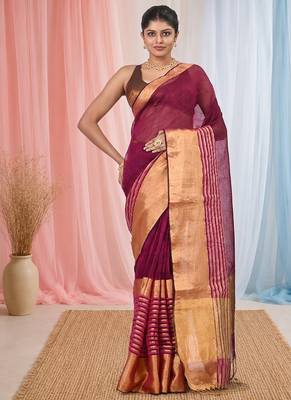Elegant magenta and gold linen saree with striped borders 1