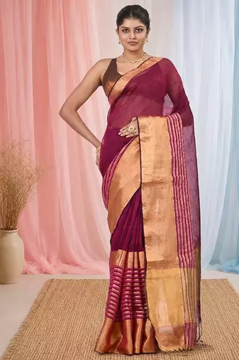 Elegant magenta and gold linen saree with striped borders