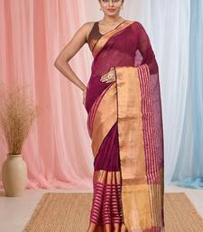 Elegant magenta and gold linen saree with striped borders