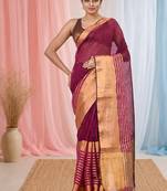 Elegant magenta and gold linen saree with striped borders
