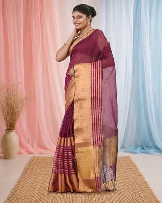 Elegant magenta and gold linen saree with striped borders 2