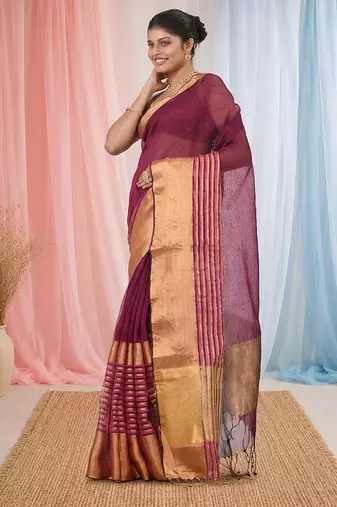 Elegant magenta and gold linen saree with striped borders
