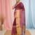 Elegant magenta and gold linen saree with striped borders