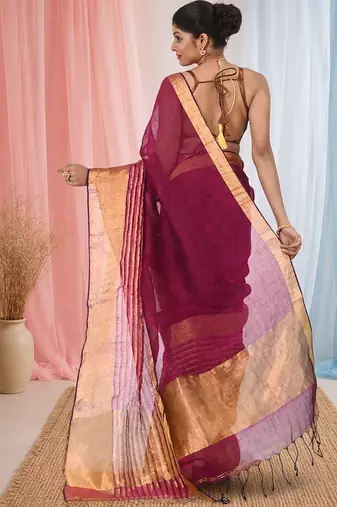 Elegant magenta and gold linen saree with striped borders