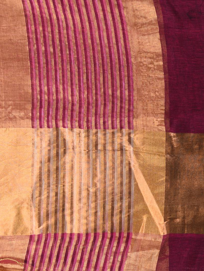 Elegant magenta and gold linen saree with striped borders
