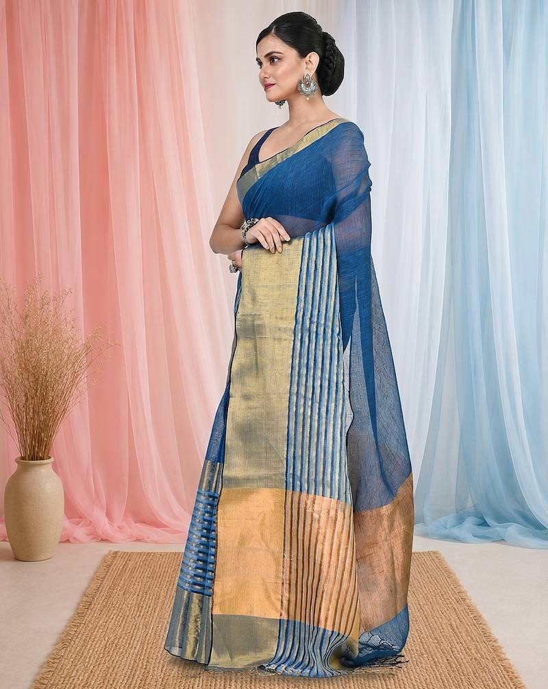 Elegant sapphire blue and gold linen saree with striped borders