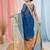 Elegant sapphire blue and gold linen saree with striped borders
