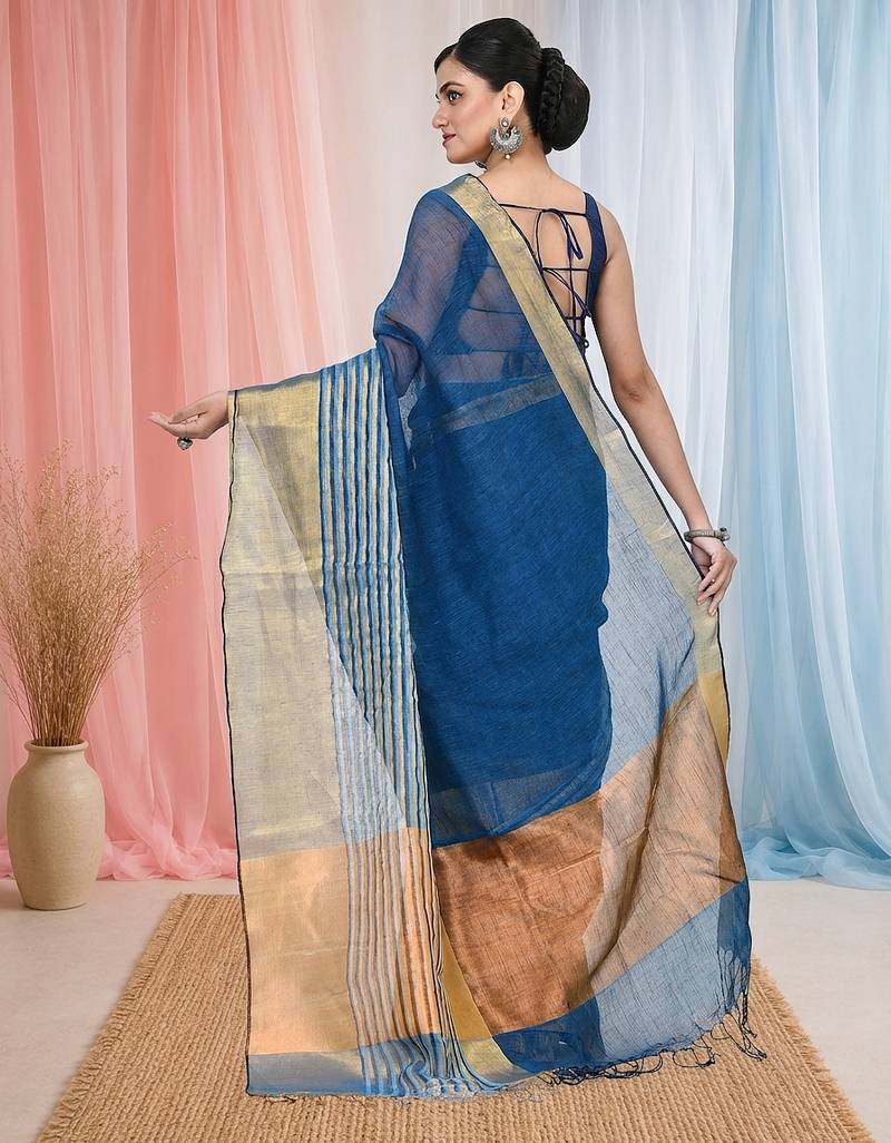 Elegant sapphire blue and gold linen saree with striped borders