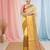 Elegant yellow and gold linen saree with striped borders