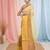 Elegant yellow and gold linen saree with striped borders
