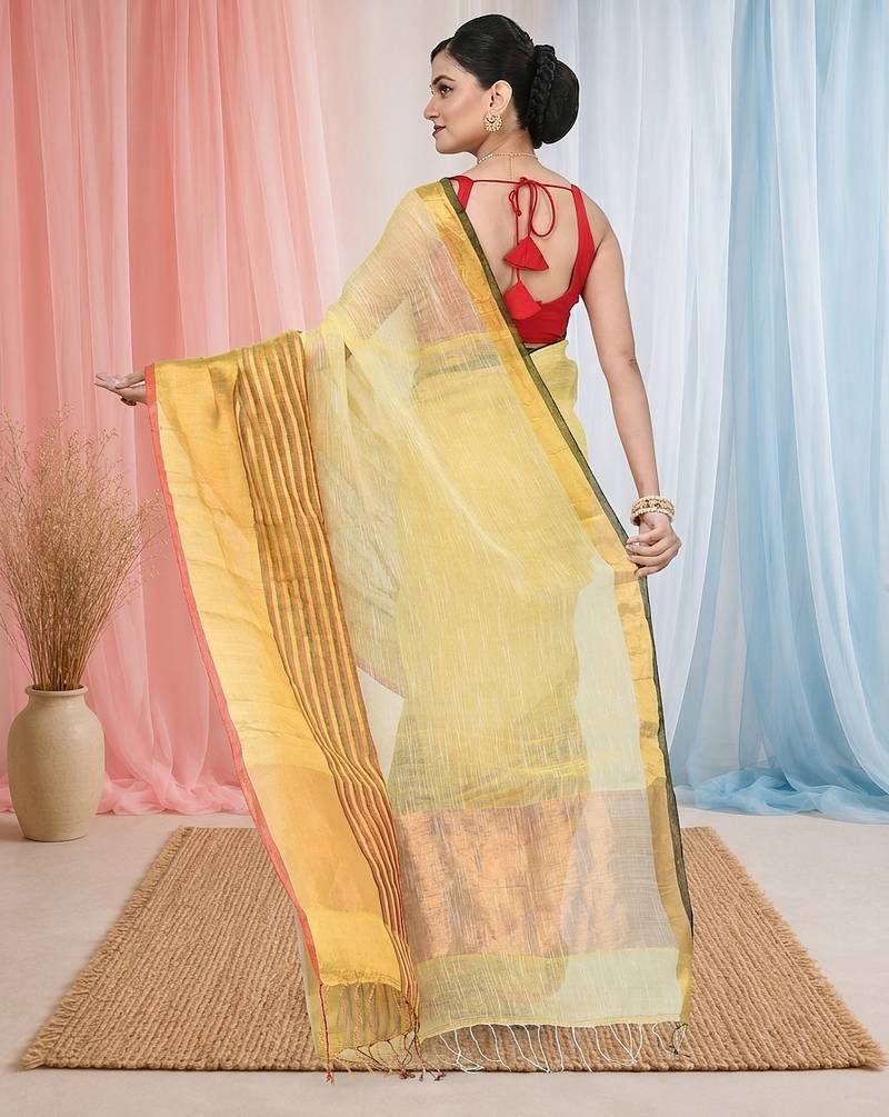 Elegant yellow and gold linen saree with striped borders