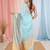 Elegant sky blue and gold linen saree with striped borders