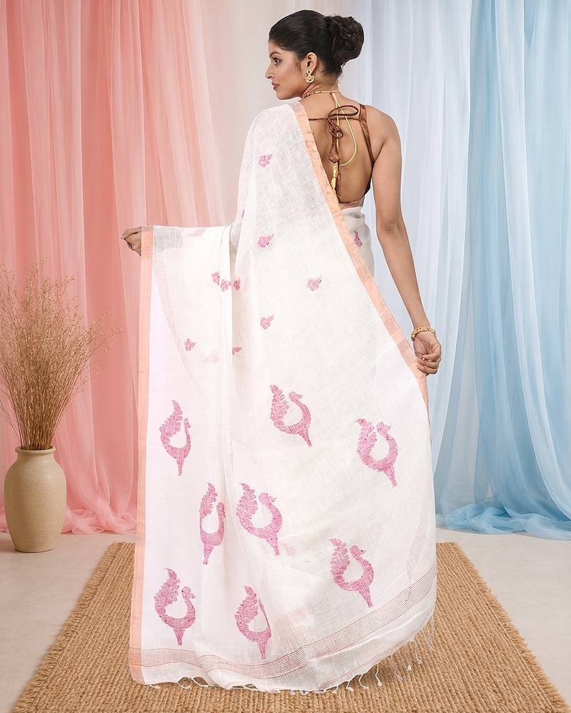 White linen saree with pink bird & texture motifs and zari borders