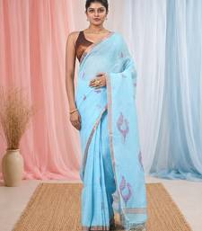 Sky blue linen saree with pink bird & texture motifs and zari borders