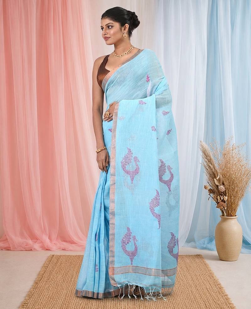 Sky blue linen saree with pink bird & texture motifs and zari borders