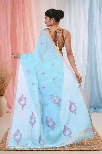 Sky blue linen saree with pink bird & texture motifs and zari borders