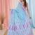 sky blue cotton blend saree with traditional woven patterns and tassel border