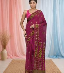 magenta cotton blend saree with traditional woven patterns and tassel border