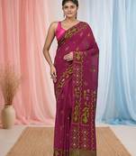 magenta cotton blend saree with traditional woven patterns and tassel border