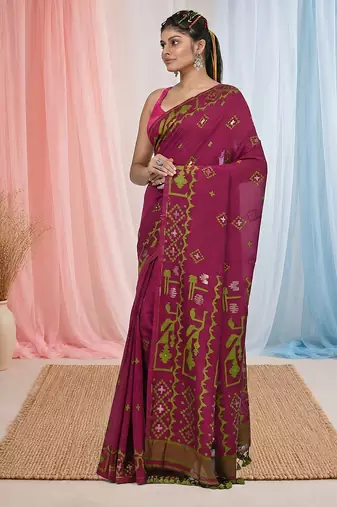 magenta cotton blend saree with traditional woven patterns and tassel border