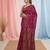 magenta cotton blend saree with traditional woven patterns and tassel border