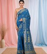 sapphire blue cotton blend saree with traditional woven patterns and tassel border