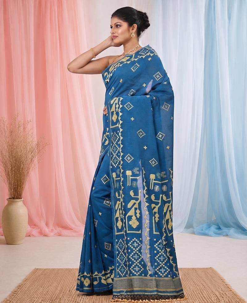 sapphire blue cotton blend saree with traditional woven patterns and tassel border
